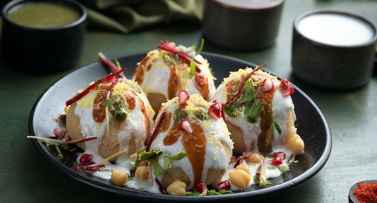 Chat is traditionally prepared using crisp fried dough wafers known as papdi and boiled chickpeas. The boiled potatoes, dahi (yogurt), and tamarind chutney topped with chat masala and sev.